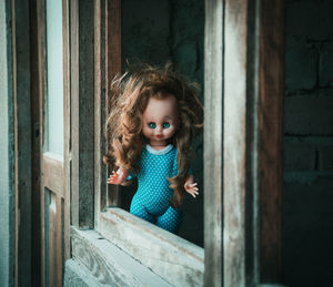 Spooky doll by window