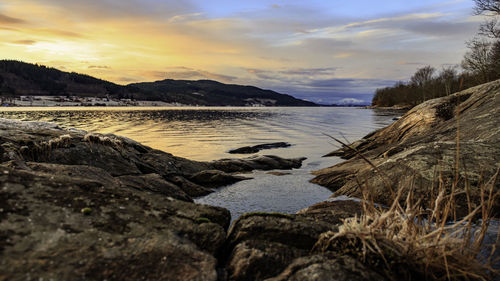 Scenic view of lake against sky during sunset