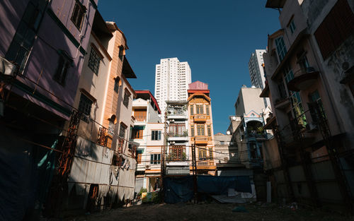 Low angle view of buildings against clear sky