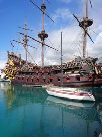 Boats moored at harbor