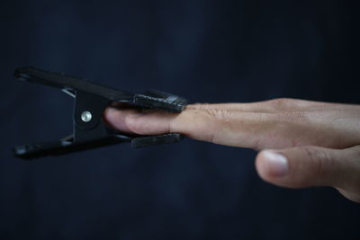 Close-up of hand holding camera