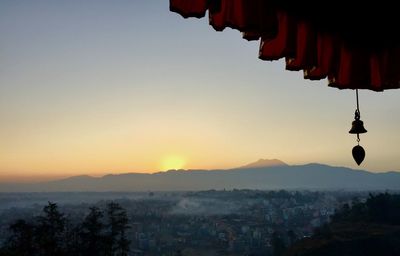 Panoramic view of temple against sky during sunrise 