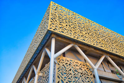 Low angle view of building against blue sky