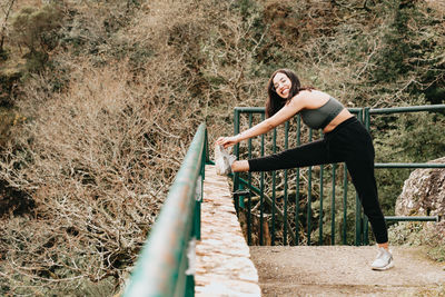 Rear view of woman standing on steps