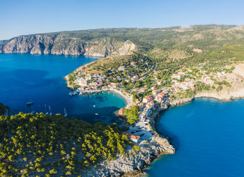 High angle view of bay against clear blue sky