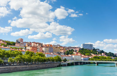 View of buildings by swimming pool in city