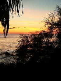 Scenic view of sea against sky at sunset