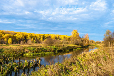 Scenic view of lake against sky during autumn