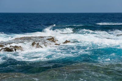 Scenic view of sea against clear sky