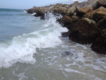 Waves splashing on rocks