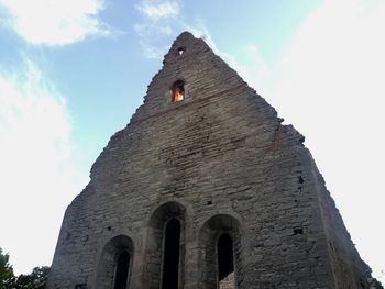 Low angle view of old building against sky