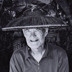 Portrait of smiling senior man wearing hat