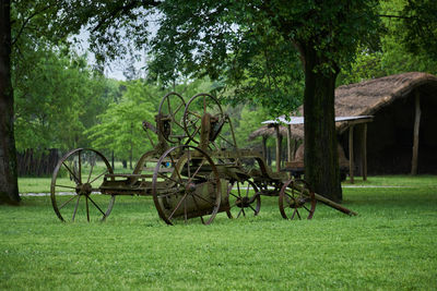 View of old cart on field