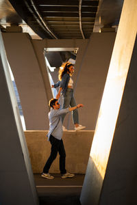 Low angle view of people walking on staircase