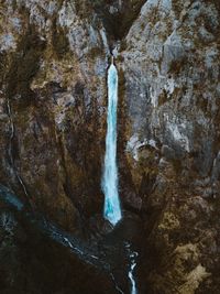 Scenic view of waterfall on mountain