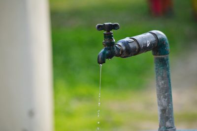 Close-up of water falling from faucet