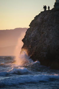 Scenic view of sea against clear sky during sunset