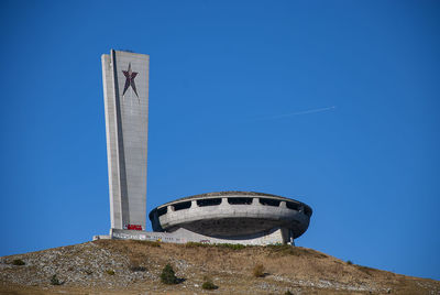 Low angle view of historical building against clear blue sky