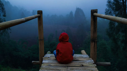 A boy sitting and enjoying the view