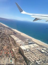 Cropped image of airplane flying over landscape