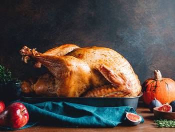 Close-up of roast turkey on table