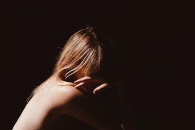 Close-up of hands over black background