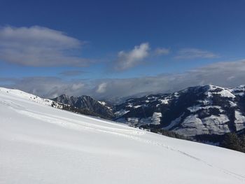 Snow covered mountains against sky