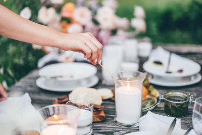 Midsection of woman preparing food on table