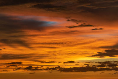 Low angle view of dramatic sky during sunset