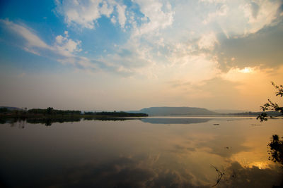 Scenic view of lake against sky during sunset