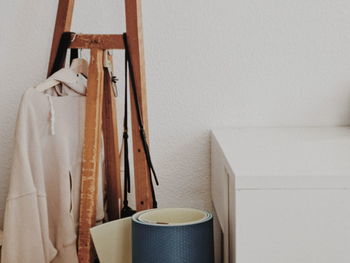 Close-up of clothes hanging on wall at home