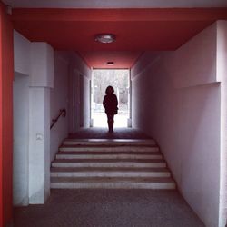 Full length of woman walking in corridor