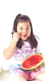 Portrait of cute girl over white background