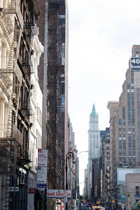 Panoramic view of buildings in city against sky