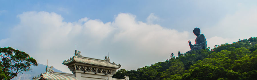 Low angle view of statue against sky