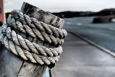 Close-up of rope tied on wood