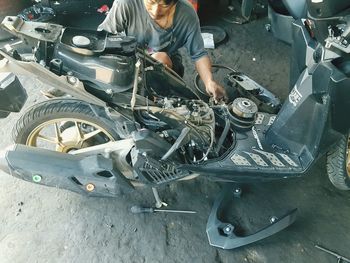 Man working on motorcycle