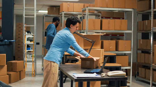 Side view of man working at home