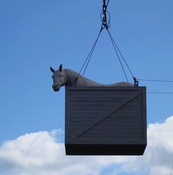 Low angle view of sculpture against sky