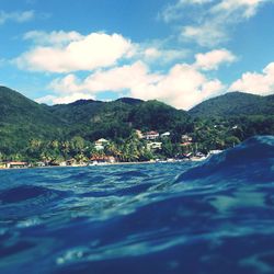 Scenic view of sea against cloudy sky