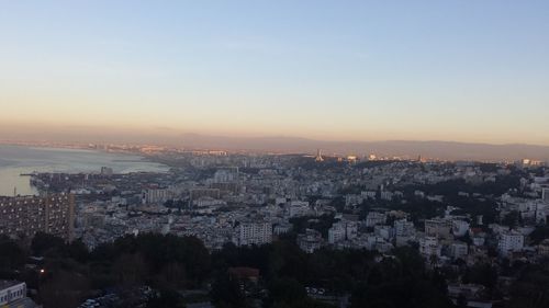 Aerial view of cityscape against clear sky