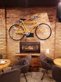 Bicycle parked against wall at home