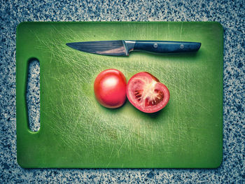 High angle view of tomatoes on cutting board