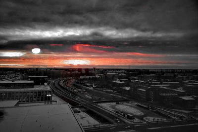Aerial view of cityscape against sky during sunset