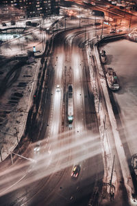 High angle view of light trails on road at night