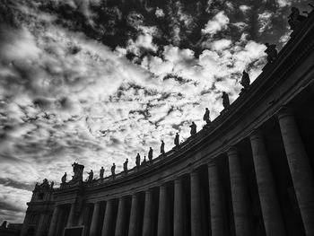 Low angle view of building against cloudy sky