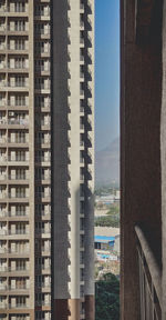 Buildings in city against clear sky