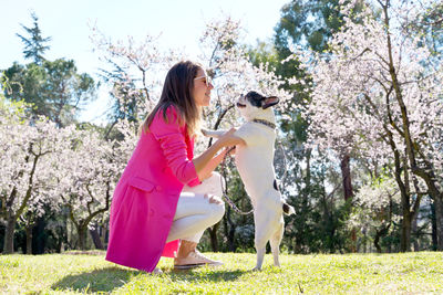 Side view of woman standing on field