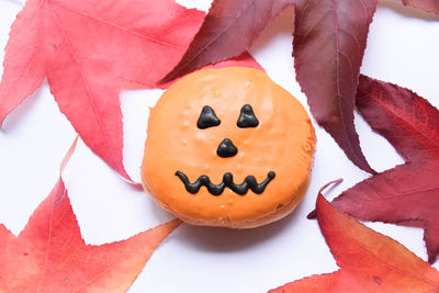 High angle view of face of pumpkin and pumpkins