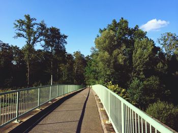 View of footbridge against sky